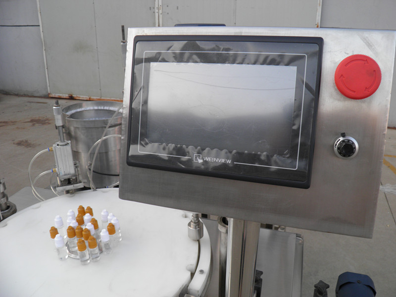 filling plugging capping labeling production line E liquid PLC כיסוי מילוי בקבוק labeling.jpg