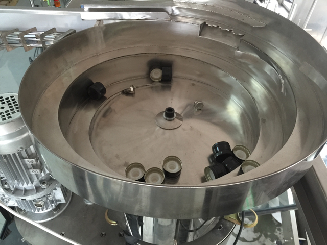 כובעים ויברטור האכלה מערכת.jpg