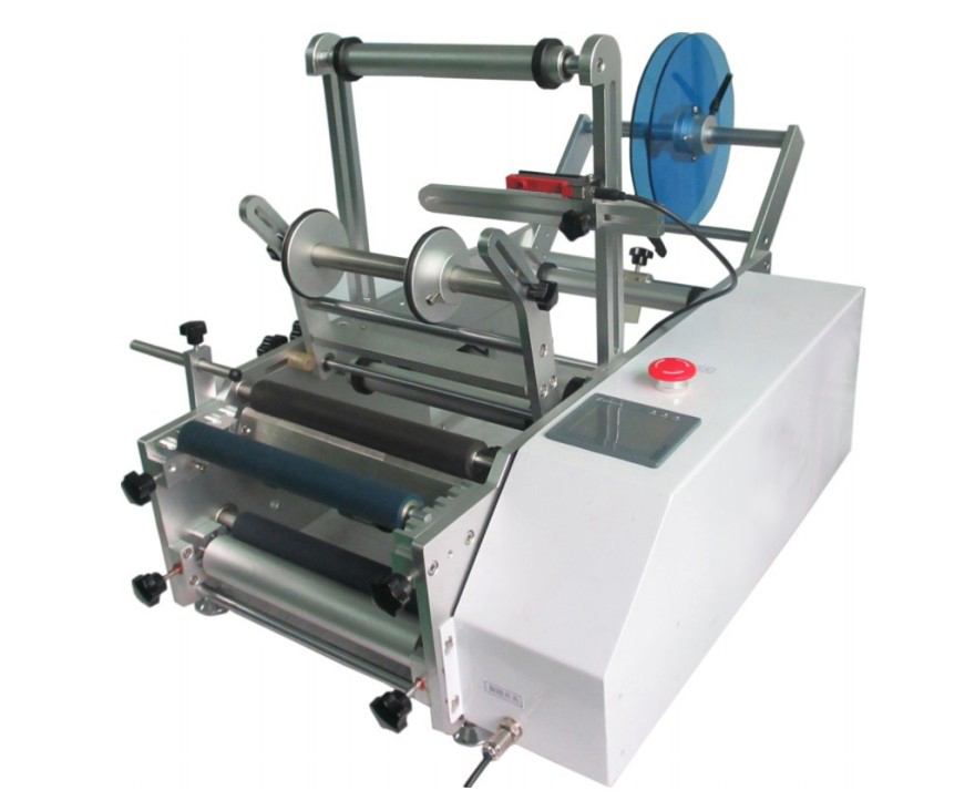 pharmaceutical equipment labeling machine for syringes מכונת תיוג בקבוקים עגולים.jpg